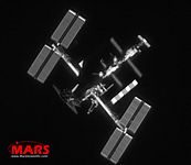 MARS' ground-based image of the International Space Station in orbit, taken with MARS satellite tracking software and sensors. (Note the Space Shuttle Atlantis docked at bottom.) Speed 28,000 km/hour, Distance 350 km. Many 'claim' to photograph satellites: Ask to see their images. MARS invites you to compare our data.